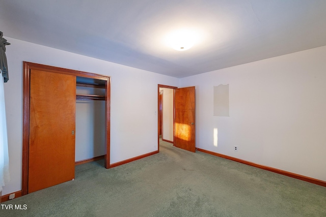 unfurnished bedroom featuring a closet and light carpet