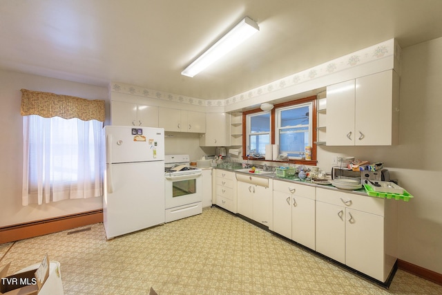 kitchen with white appliances, baseboard heating, white cabinets, and plenty of natural light