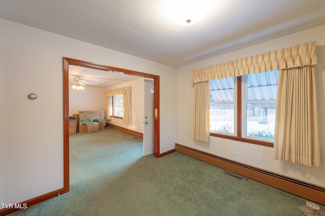 unfurnished room featuring ceiling fan, carpet floors, and a baseboard radiator