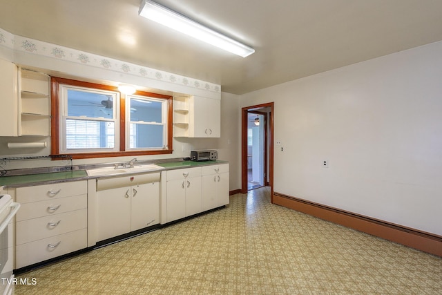 kitchen featuring a sink, a baseboard radiator, open shelves, and white cabinetry