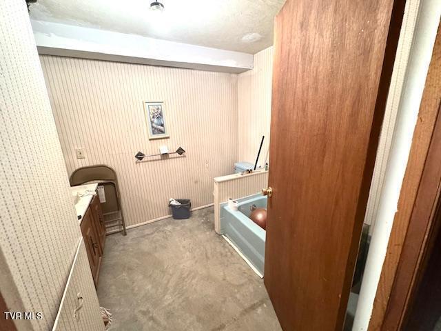 bathroom with a tub to relax in