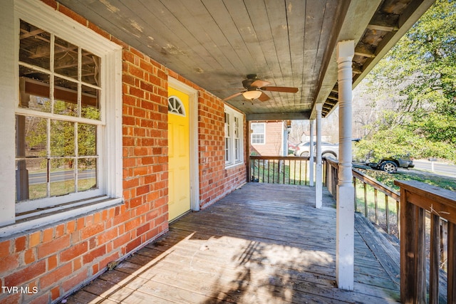 deck featuring ceiling fan and a porch