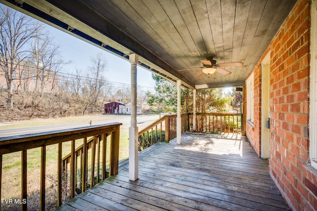 wooden deck with ceiling fan and covered porch