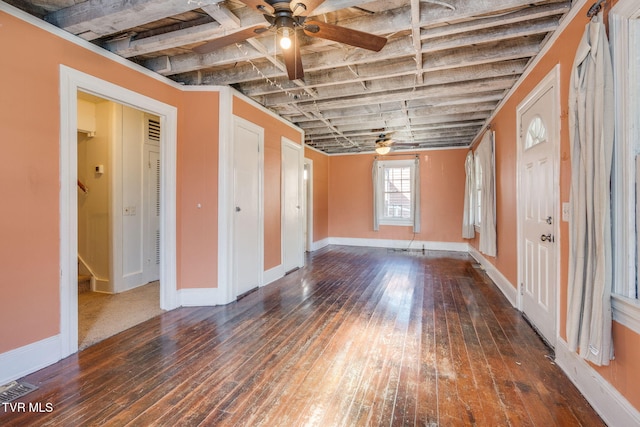 unfurnished room featuring ceiling fan and dark wood-type flooring