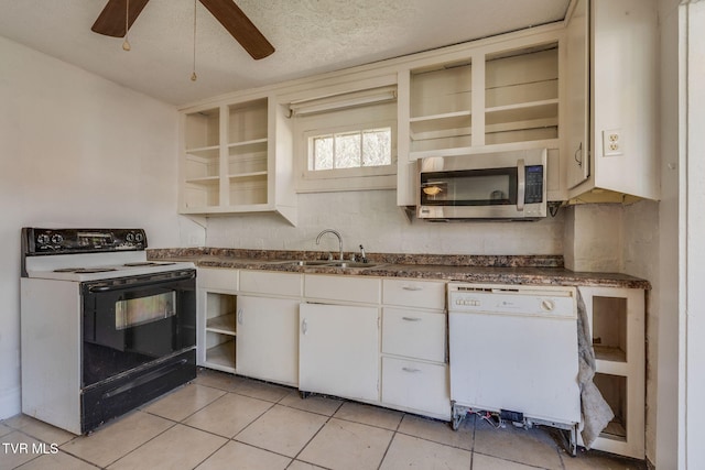 kitchen featuring ceiling fan, sink, a textured ceiling, white appliances, and white cabinets