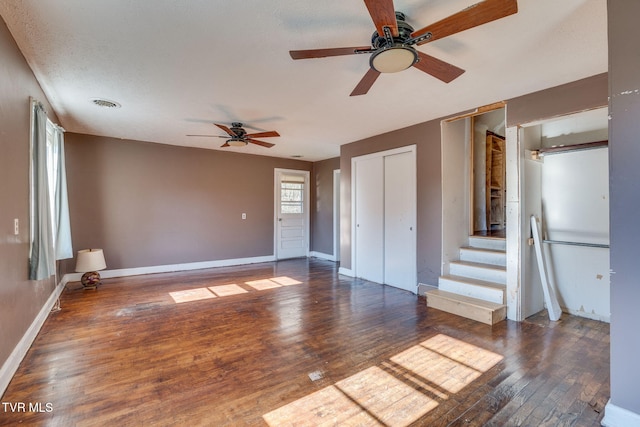 interior space with dark hardwood / wood-style floors and ceiling fan