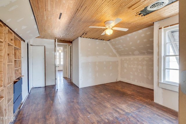 additional living space featuring dark wood-type flooring, wooden ceiling, ceiling fan, and lofted ceiling