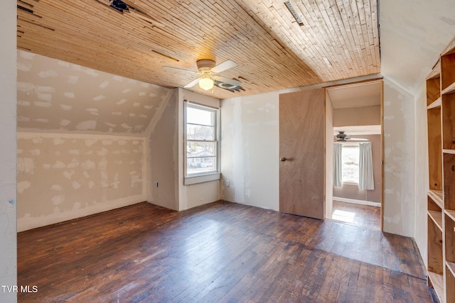 bonus room with plenty of natural light, dark hardwood / wood-style flooring, wood ceiling, and vaulted ceiling