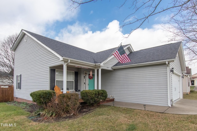 view of front facade featuring a garage and a front yard