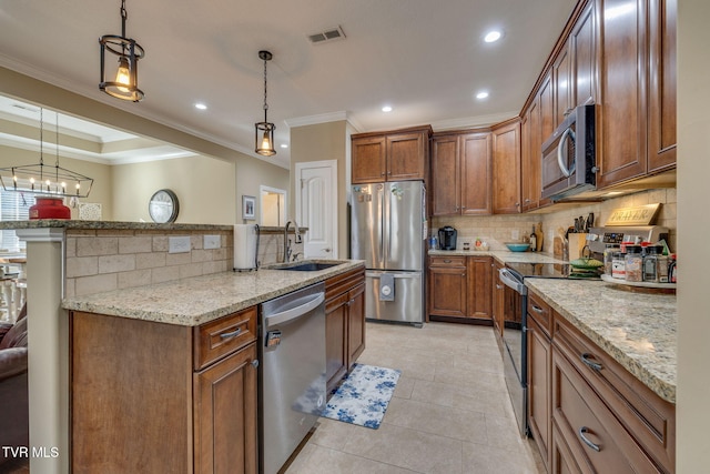 kitchen with sink, crown molding, tasteful backsplash, pendant lighting, and stainless steel appliances