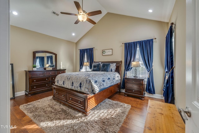 bedroom featuring high vaulted ceiling, dark wood-type flooring, and ceiling fan