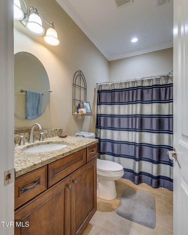 bathroom with crown molding, vanity, and toilet