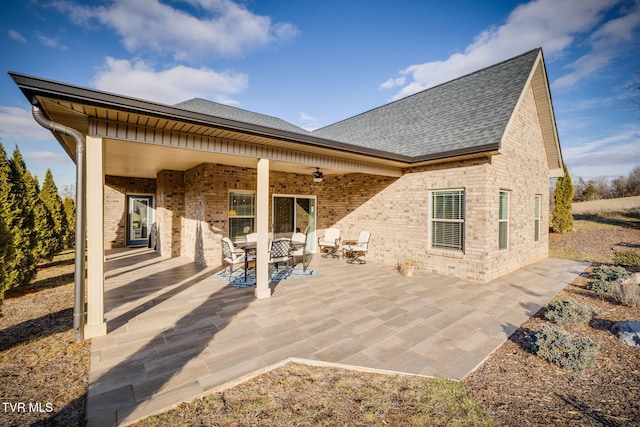 back of property featuring a patio area and ceiling fan