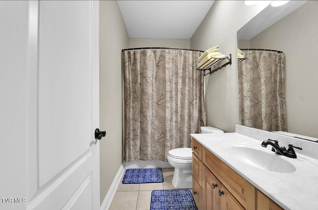 bathroom featuring toilet, vanity, and tile patterned floors