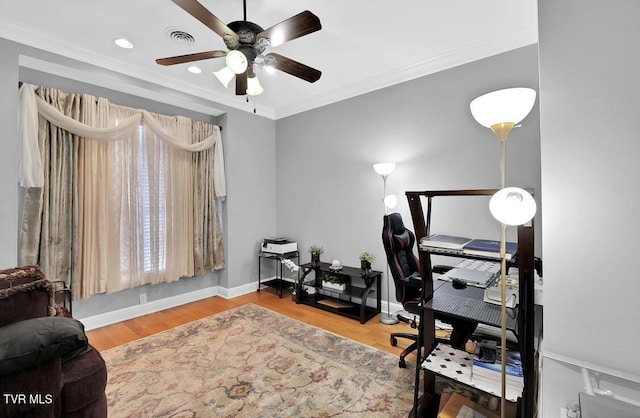 office space with ceiling fan, ornamental molding, and hardwood / wood-style flooring