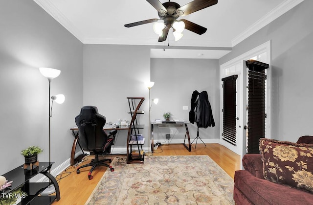 office space featuring hardwood / wood-style floors, ceiling fan, and crown molding