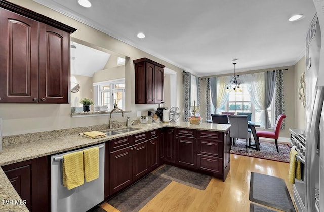 kitchen with light stone countertops, pendant lighting, an inviting chandelier, dishwasher, and light hardwood / wood-style floors