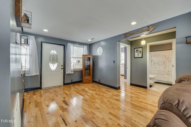 entryway with light hardwood / wood-style flooring