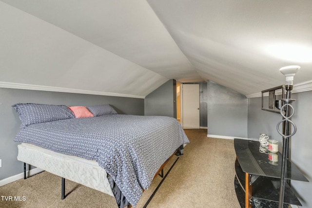 carpeted bedroom with lofted ceiling