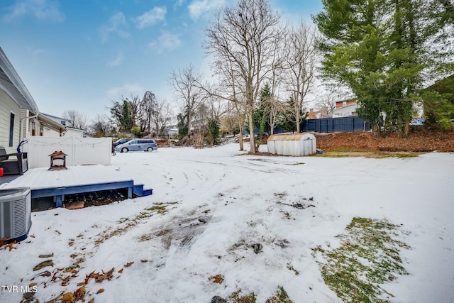 snowy yard with cooling unit