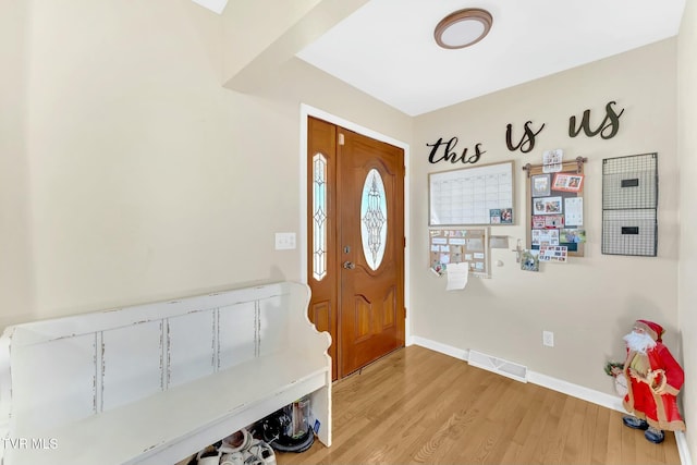 entryway with light hardwood / wood-style flooring