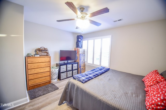 bedroom featuring ceiling fan and light hardwood / wood-style floors