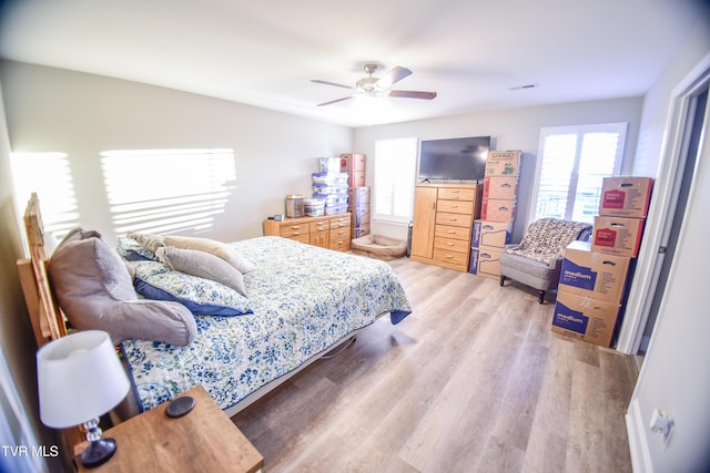 bedroom featuring ceiling fan and light hardwood / wood-style flooring