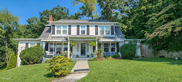 view of front of property with a front lawn and a porch