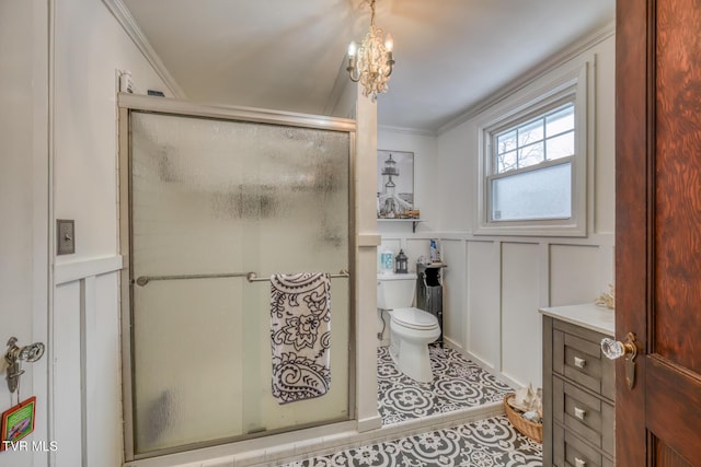 bathroom with tile patterned floors, an inviting chandelier, vanity, and ornamental molding