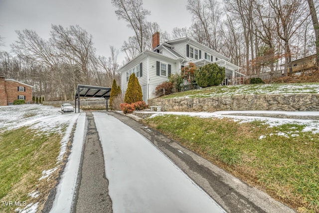 view of side of property featuring a carport