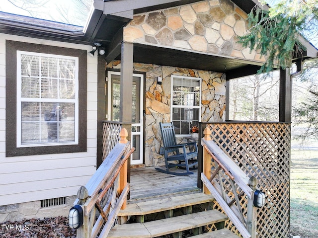 property entrance with a deck