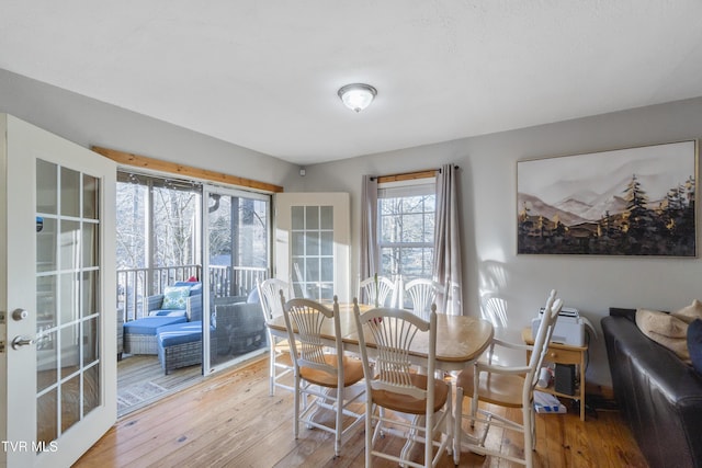 dining room featuring wood-type flooring and french doors