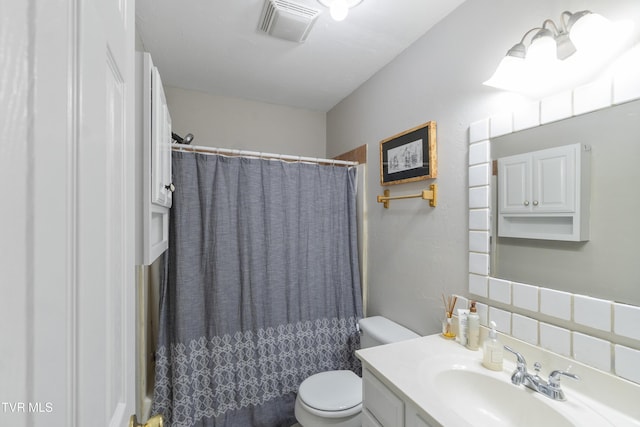 bathroom with decorative backsplash, curtained shower, toilet, and vanity