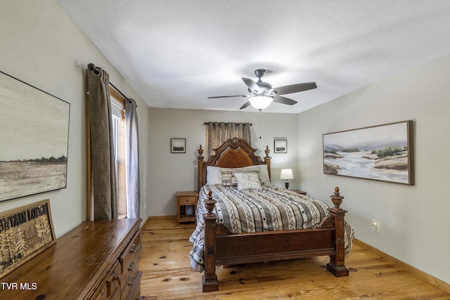 bedroom featuring ceiling fan and light hardwood / wood-style flooring