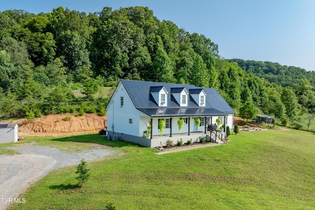 view of front of property with a porch and a front lawn