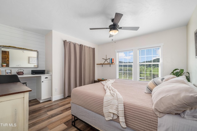 bedroom with hardwood / wood-style floors and ceiling fan