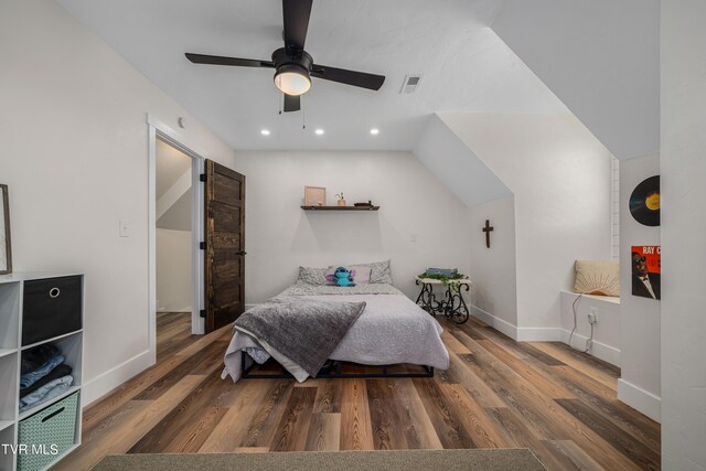 bedroom featuring lofted ceiling, ceiling fan, and dark wood-type flooring