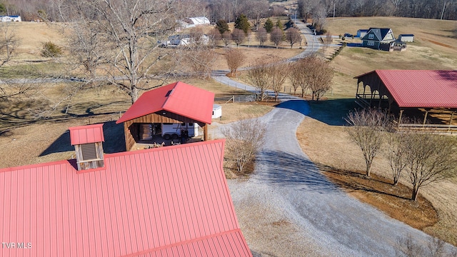 birds eye view of property featuring a rural view