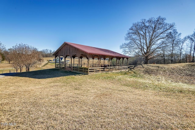 view of stable featuring a rural view