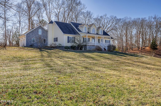 cape cod house with a porch and a front lawn