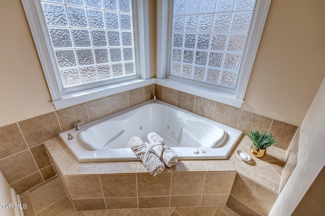 bathroom featuring tiled tub