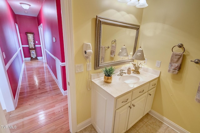 bathroom featuring hardwood / wood-style flooring and vanity