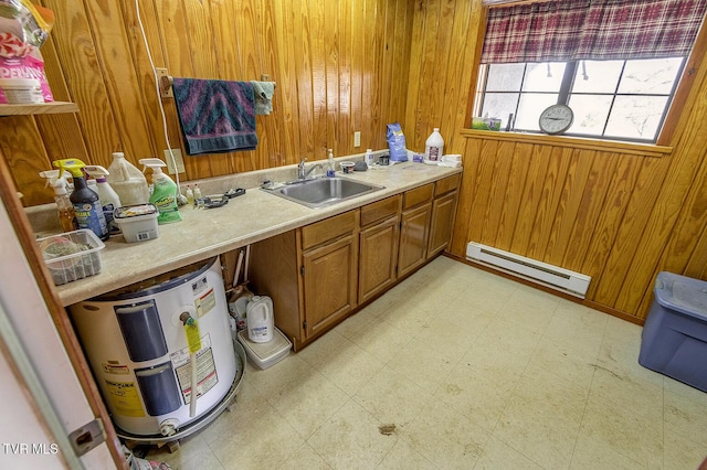 bathroom featuring a baseboard radiator, electric water heater, sink, and wood walls