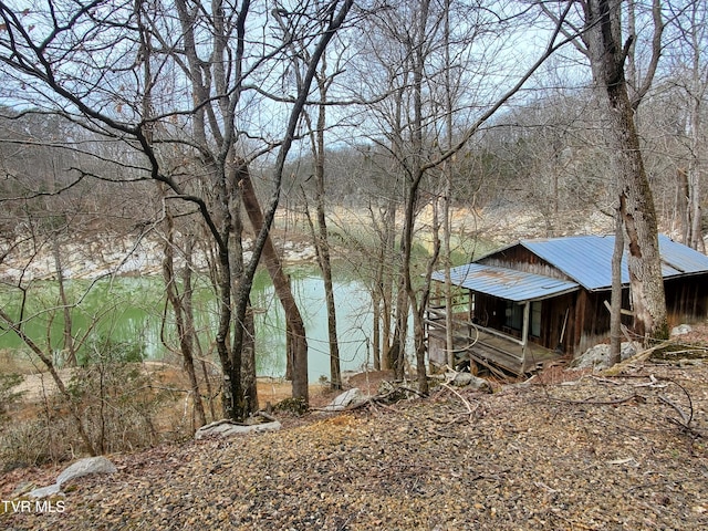 view of water feature featuring a forest view