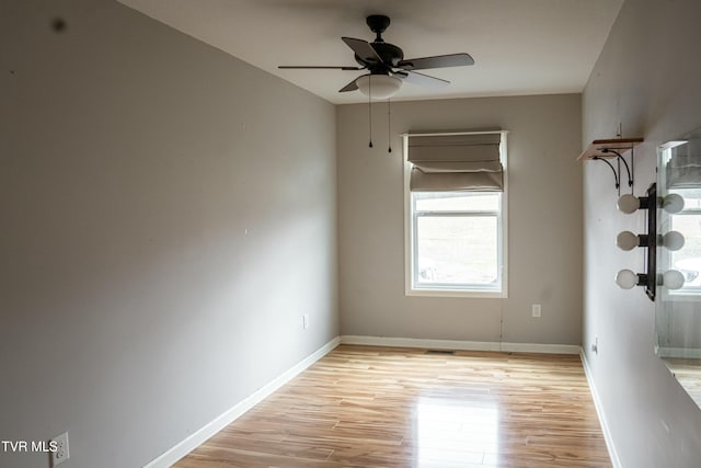 spare room with ceiling fan and light hardwood / wood-style floors