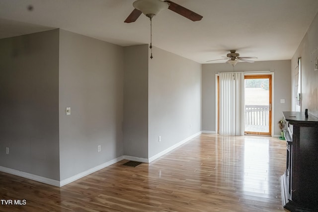 unfurnished living room with ceiling fan and light wood-type flooring