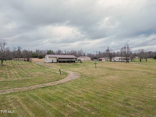 view of yard with a rural view