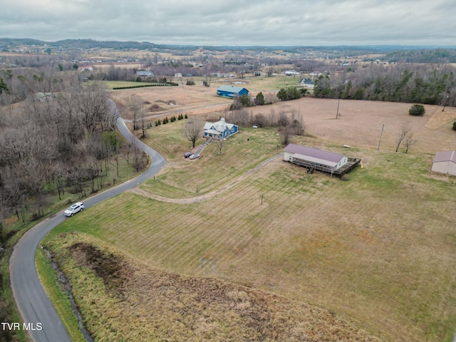 birds eye view of property with a rural view