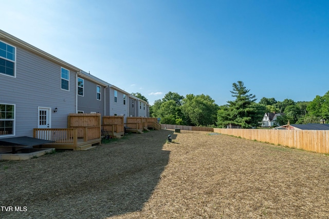 view of yard with a wooden deck