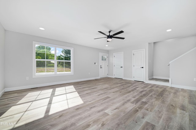 interior space featuring light hardwood / wood-style flooring and ceiling fan